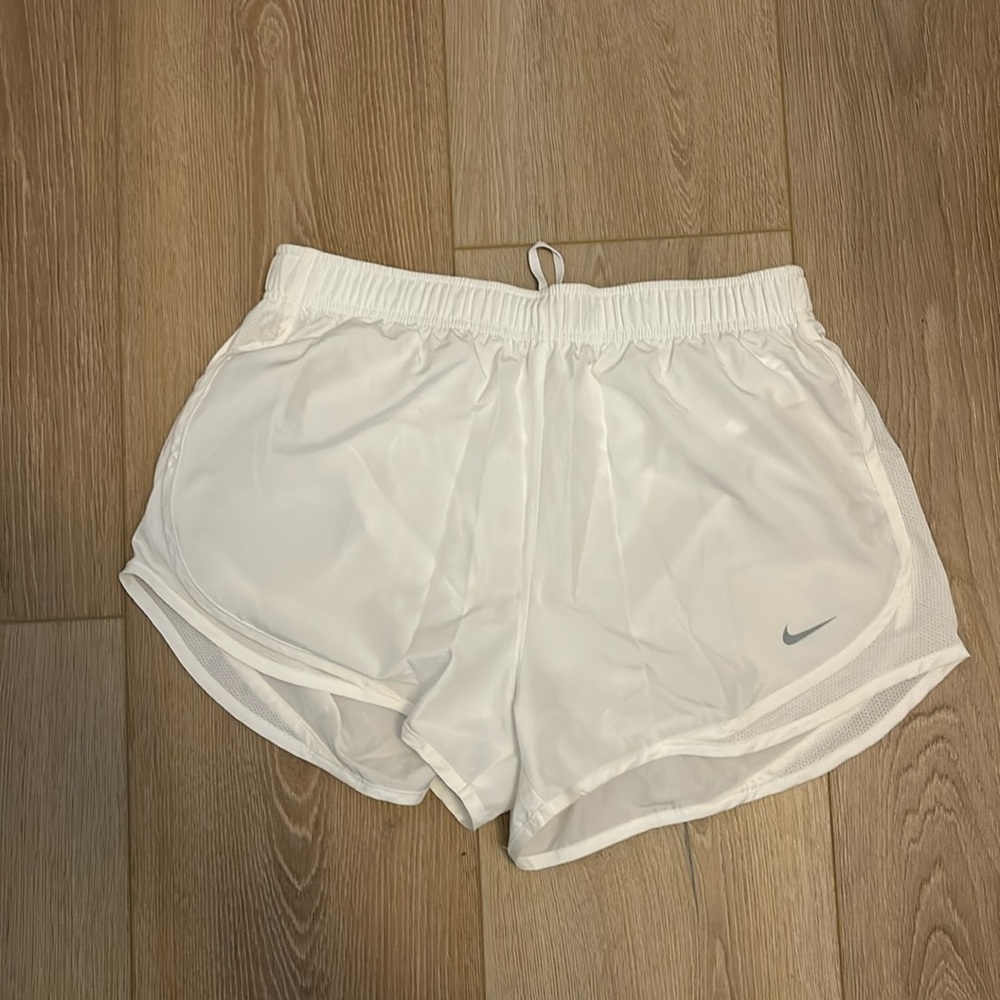 White Nike running shorts